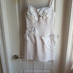 Chic White Mini Dress with Bow Accents